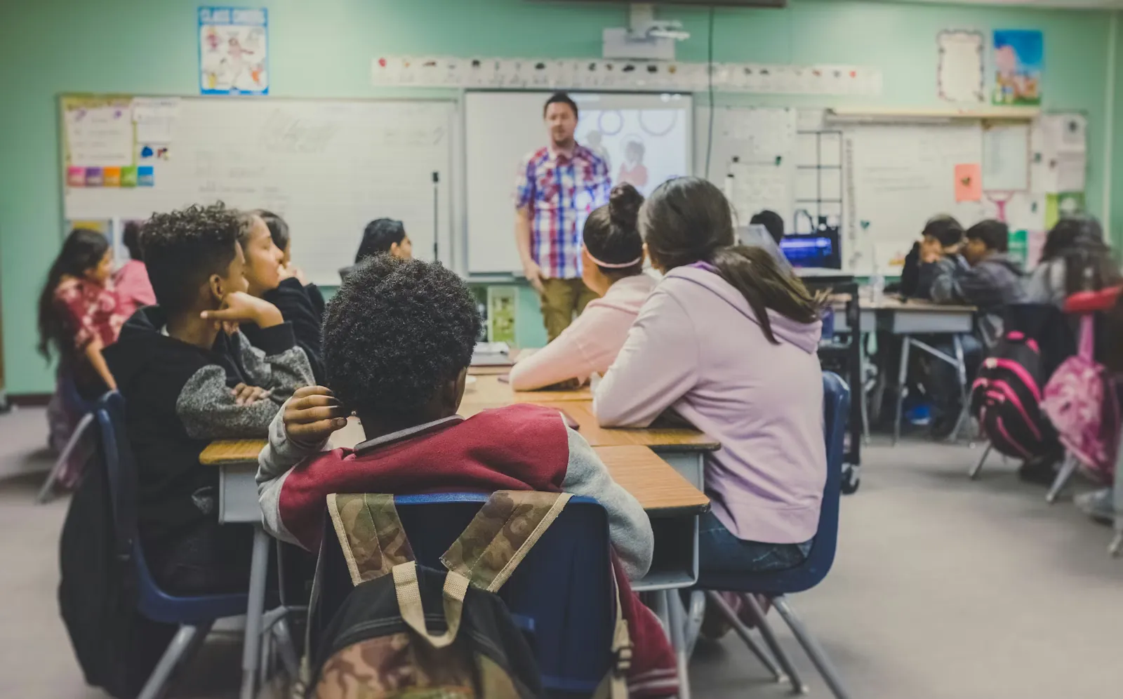 Students and educators using digital learning tools in a modern learning environment