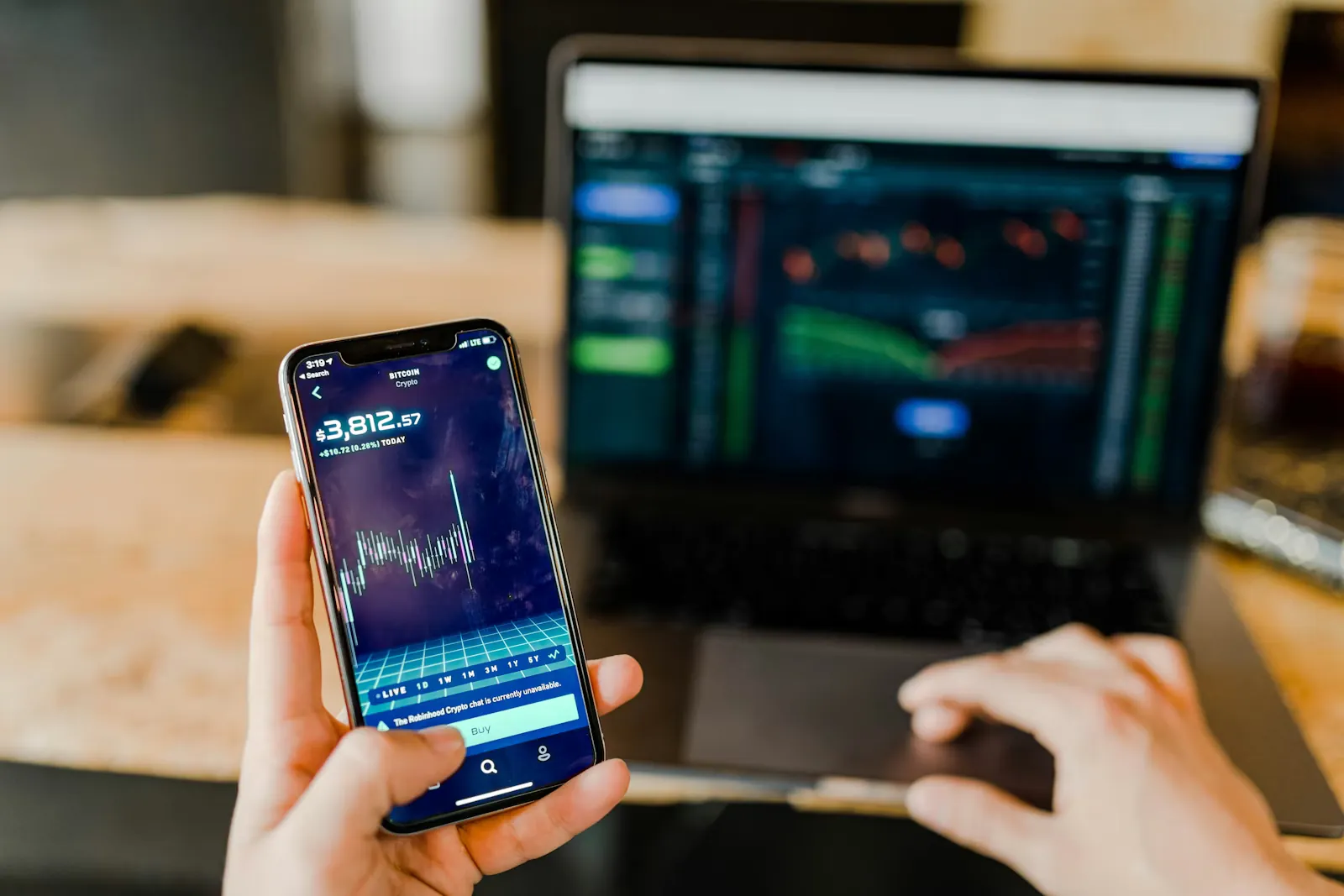 Financial professionals reviewing digital banking and risk data in a modern office